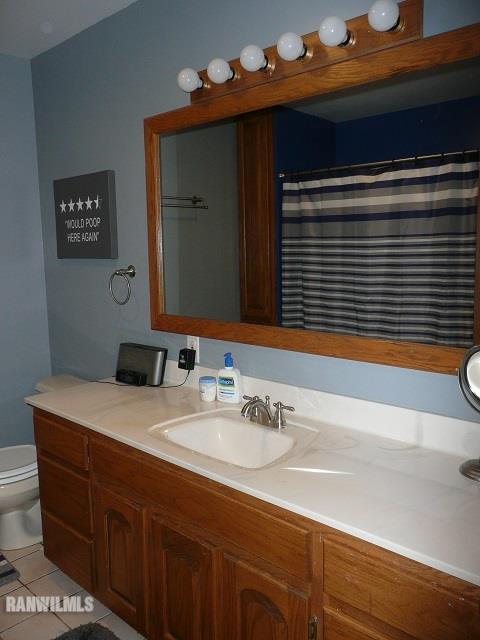 6570 West Cook Road Lena, IL 61048 - Photo 38 of 58 a bathroom with a sink and a mirror