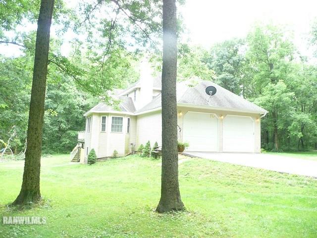 6570 West Cook Road Lena, IL 61048 - Photo 45 of 58 a house view with a garden space