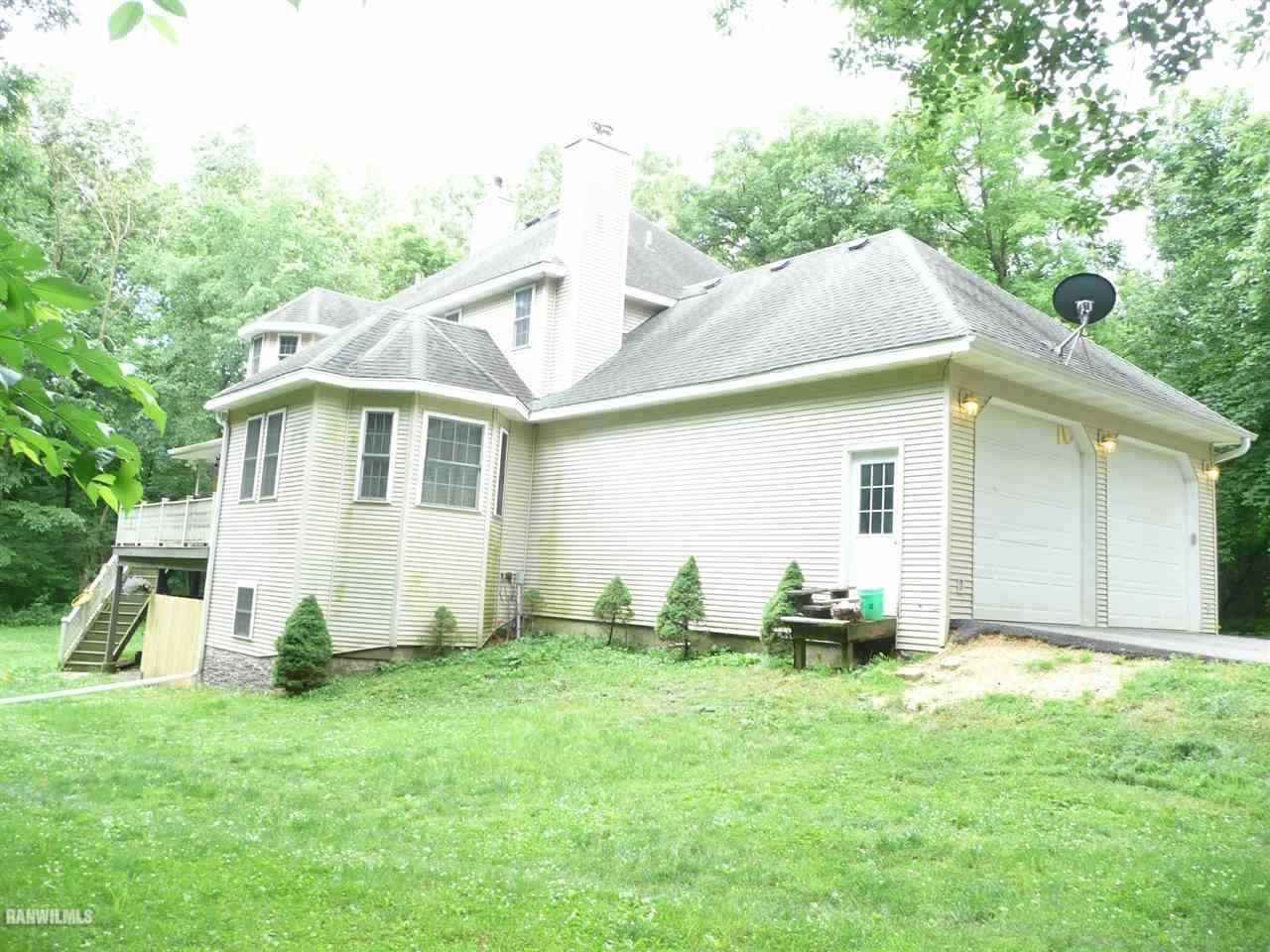 6570 West Cook Road Lena, IL 61048 - Photo 46 of 58 a backyard of a house with table and chairs