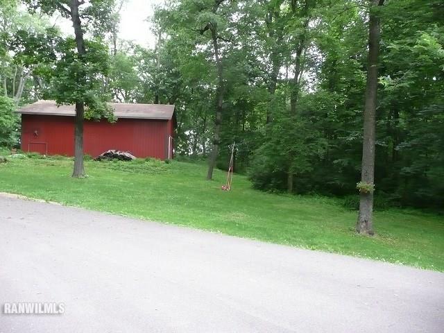 6570 West Cook Road Lena, IL 61048 - Photo 47 of 58 a view of a wooden deck and a yard