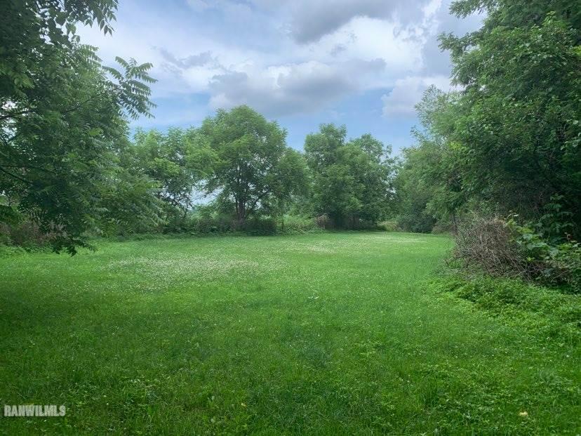 6570 West Cook Road Lena, IL 61048 - Photo 57 of 58 a view of a green field with trees in the background