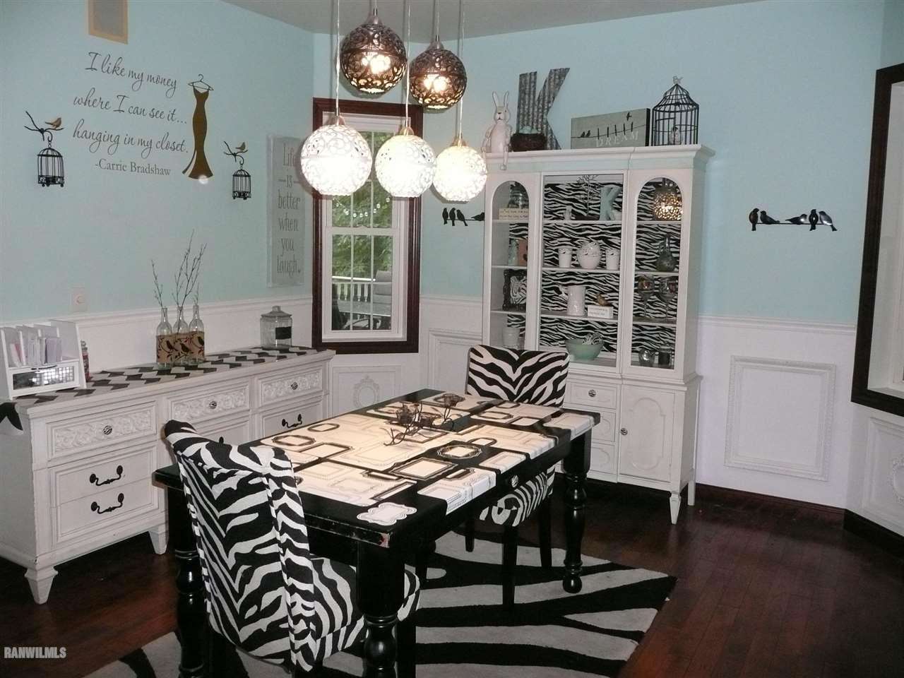 6570 West Cook Road Lena, IL 61048 - Photo 9 of 58 a view of a dining room with furniture and chandelier
