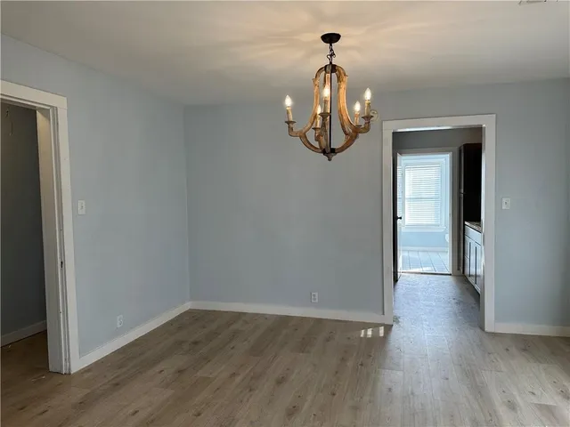 a view of a livingroom with wooden floor