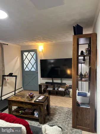 a room with furniture and flat screen tv