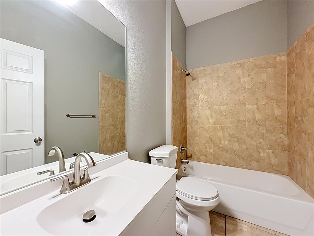 28549 Shirley Shores Road Tavares, FL 32778 - Photo 40 of 65 a bathroom with a sink toilet and shower