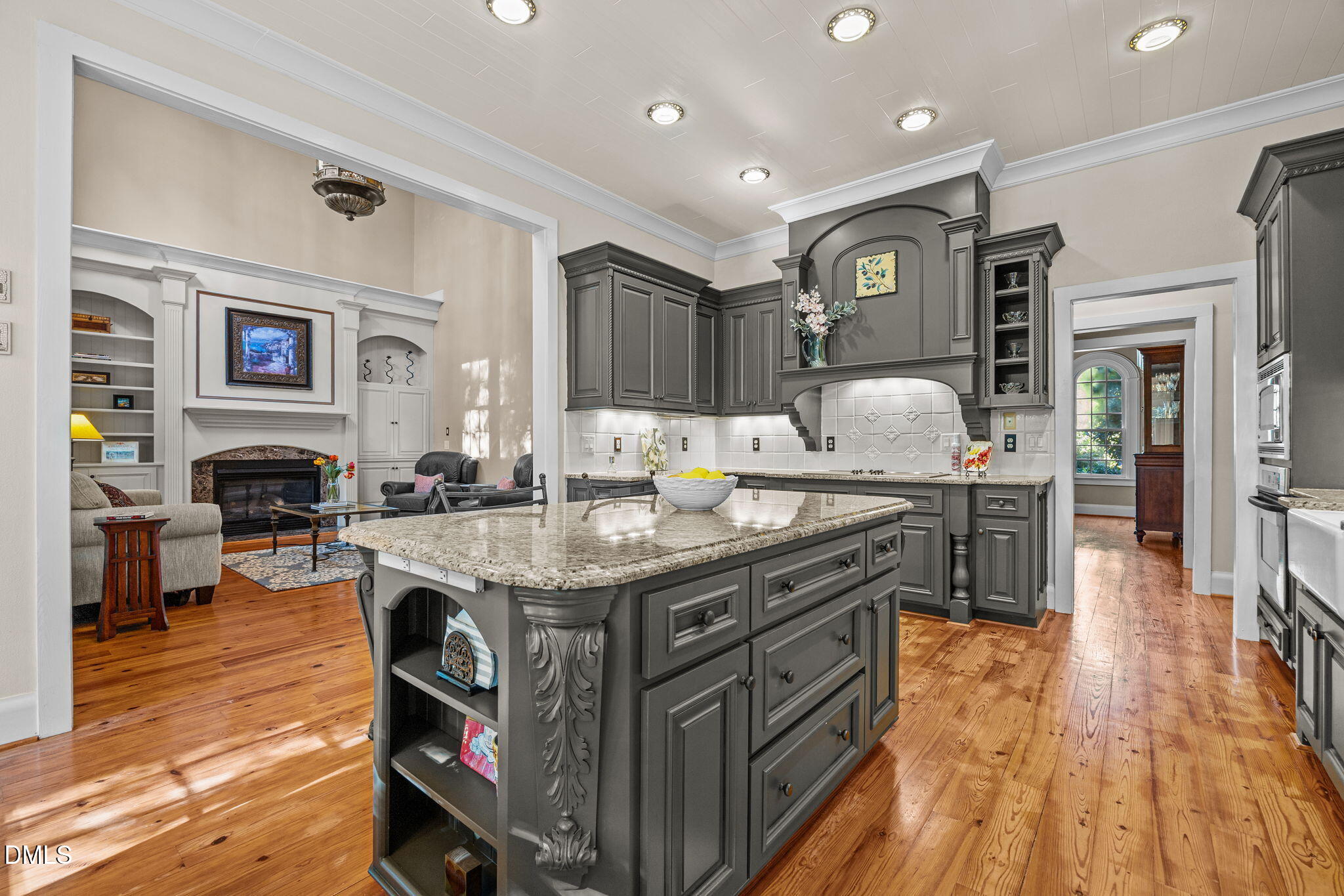 1329 Wynncrest Court Raleigh, NC 27603 - Photo 20 of 64 a kitchen with granite countertop a stove and a wooden floors
