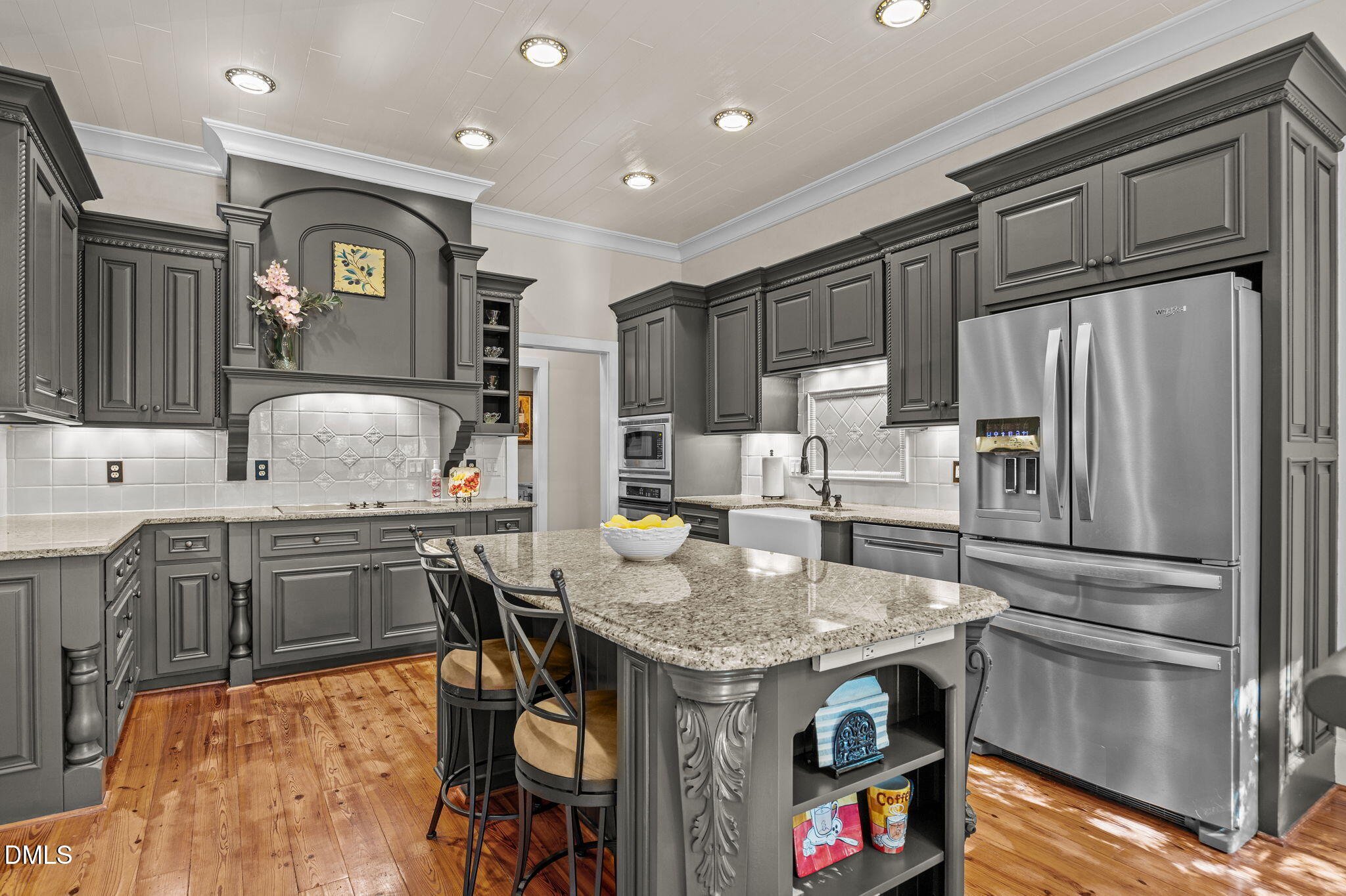 1329 Wynncrest Court Raleigh, NC 27603 - Photo 21 of 64 a kitchen with granite countertop stainless steel appliances and wooden cabinets
