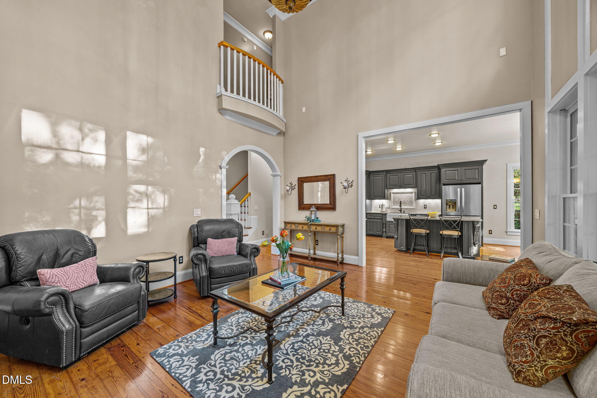 1329 Wynncrest Court Raleigh, NC 27603 - Photo 27 of 64 a living room with furniture wooden floor and a large window