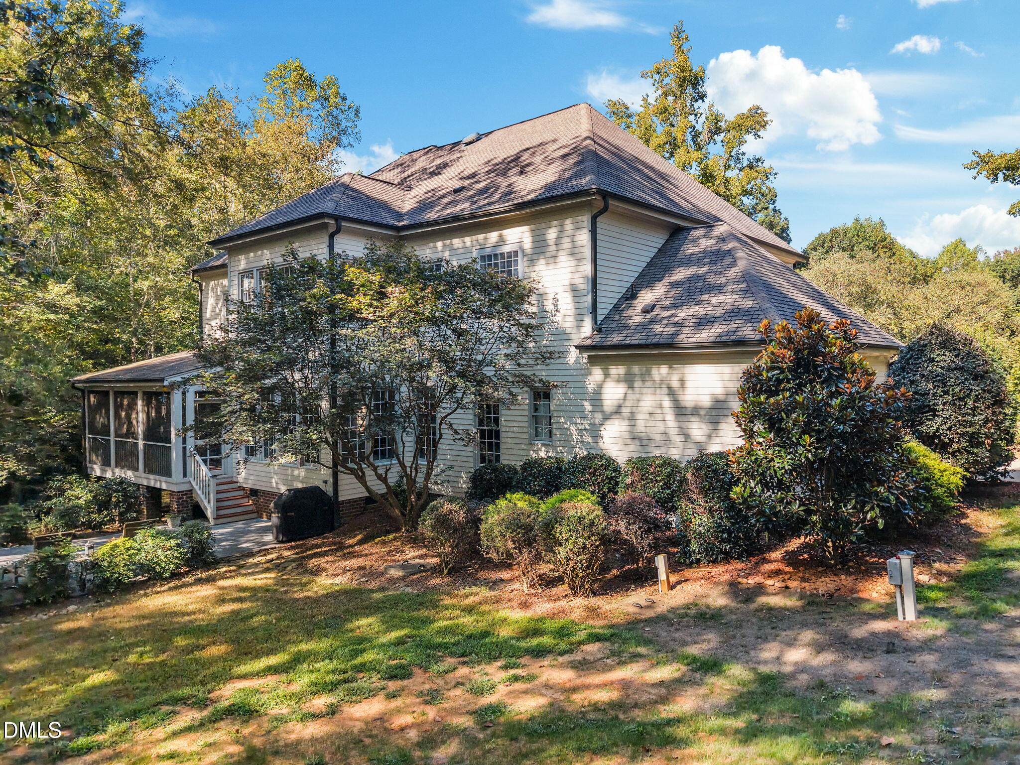 1329 Wynncrest Court Raleigh, NC 27603 - Photo 56 of 64 a yellow house with tree in front of it