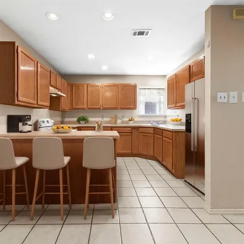 a view of a livingroom with workspace and a window