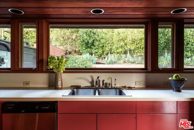 a view of a lake in middle of forest