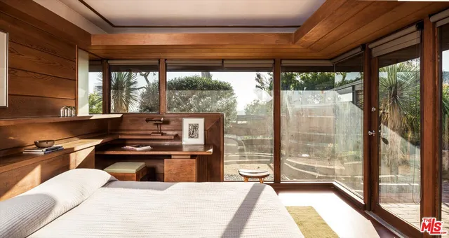 a kitchen with a stove window and cabinets