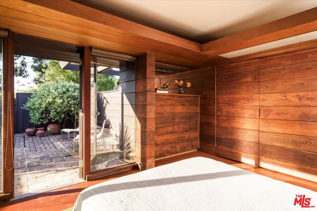 a kitchen with a sink and a potted plant