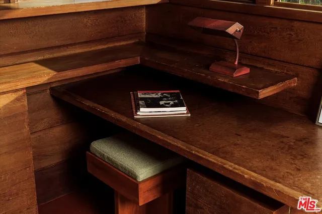 a bedroom with a bed and a view of kitchen