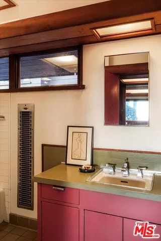 a balcony with wooden floor and fence