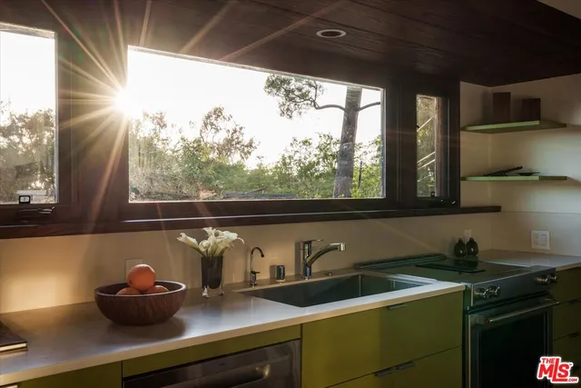 a view of a chairs and table in the patio