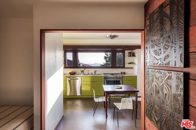 a view of a wooden house with a yard