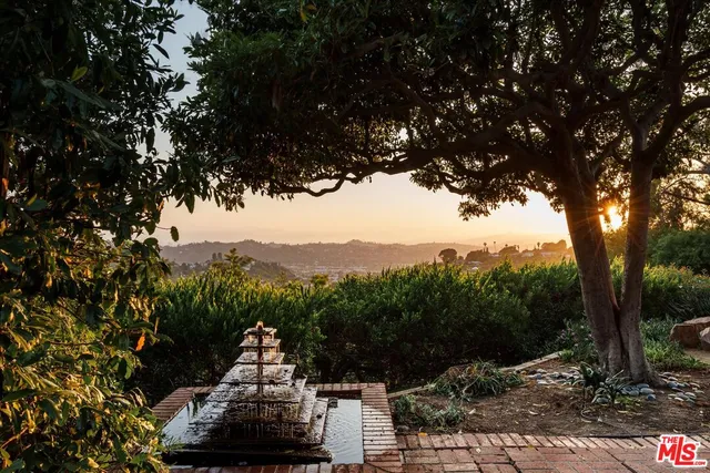 a kitchen with stainless steel appliances kitchen island granite countertop a sink stove and cabinets