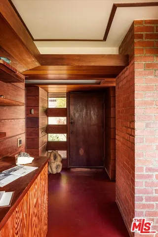 a view of a chair and tables in the balcony