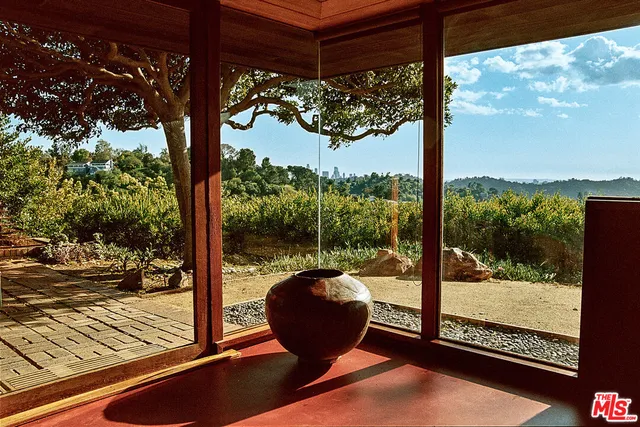a outdoor living space with patio furniture and a fireplace