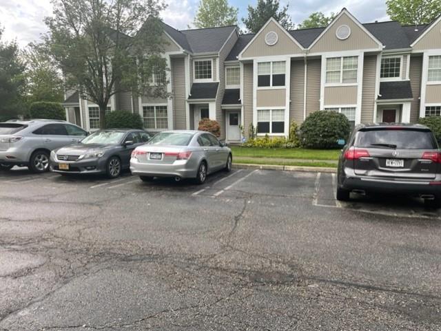 a view of a car parked in front of a house