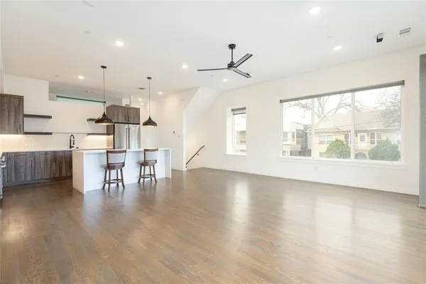 a view of a kitchen with a table and chairs