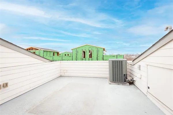 a view of balcony with wooden floor
