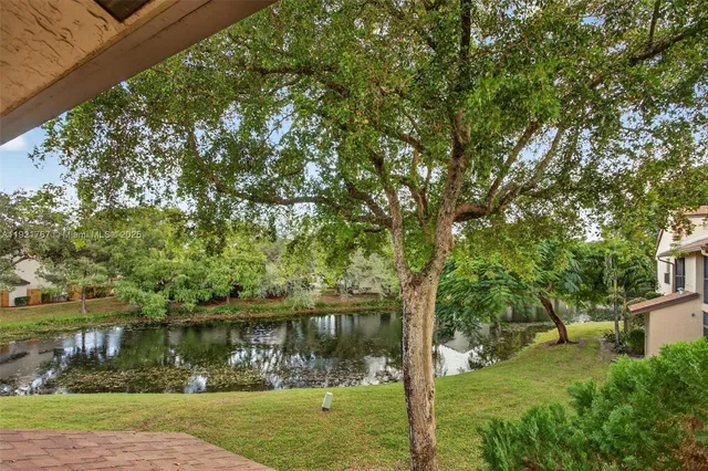 a view of lake with a house in the background