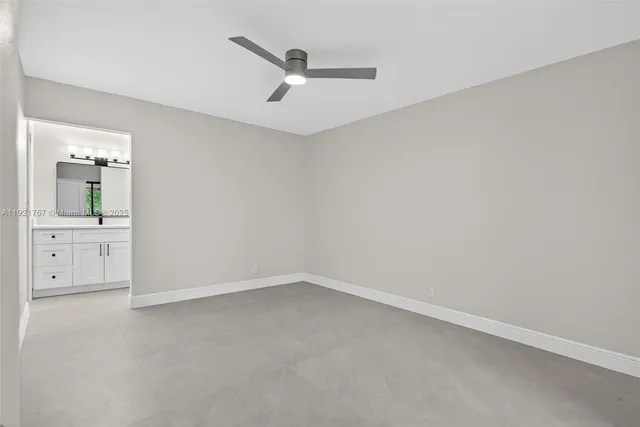 an empty room with a bathroom