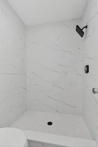 a bathroom with a shower and a bathtub