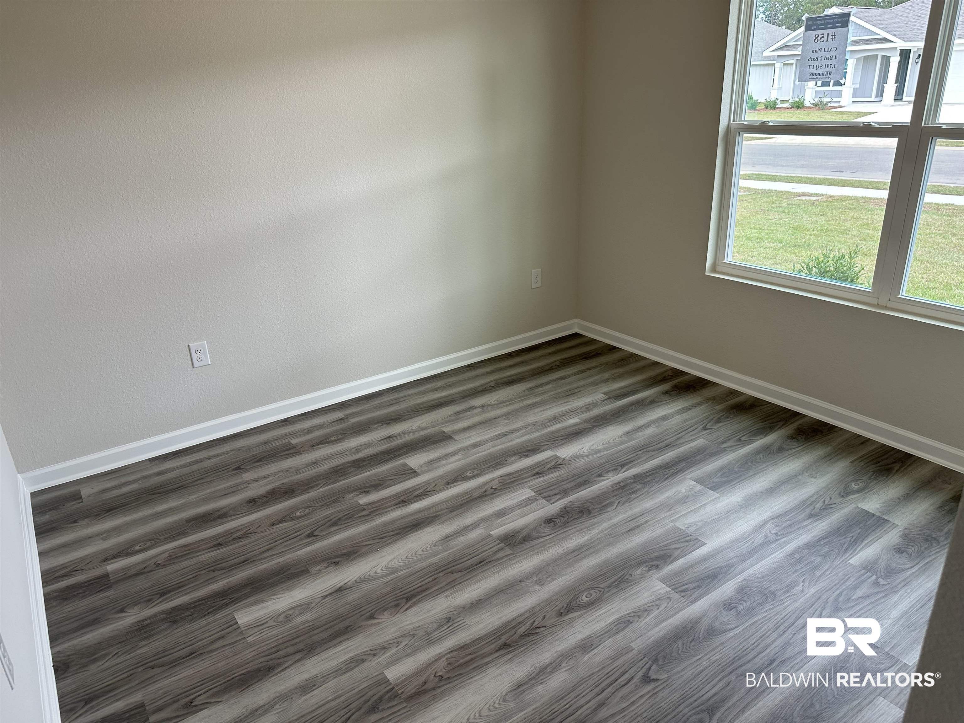 1238 Hayward Loop Foley, AL 36535 - Photo 9 of 46 Spare room with dark wood-type flooring