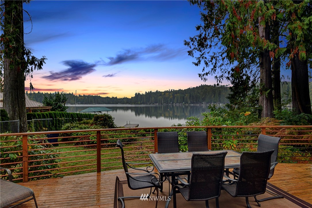 24119 South Lake Roesiger Road Snohomish, WA 98290 - Photo 1 of 1 a view of a lake with couches and wooden floor