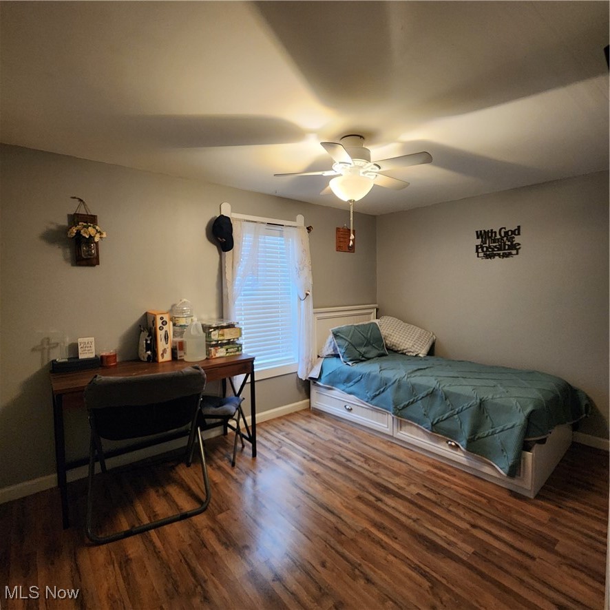 6487 Klass Road Cambridge, OH 43725 - Photo 12 of 20 Bedroom featuring wood finished floors and ceiling fan