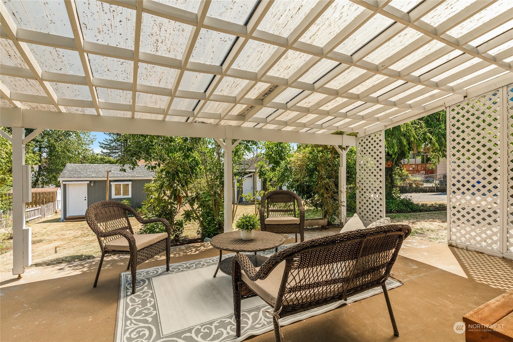 7623 Tyee Road Everett, WA 98203 - Photo 11 of 37 a view of a patio with table and chairs and potted plants