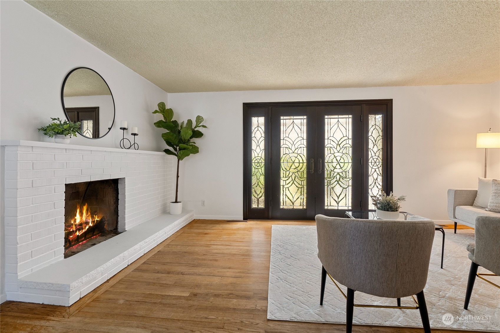 7623 Tyee Road Everett, WA 98203 - Photo 12 of 37 a living room with furniture and a fireplace