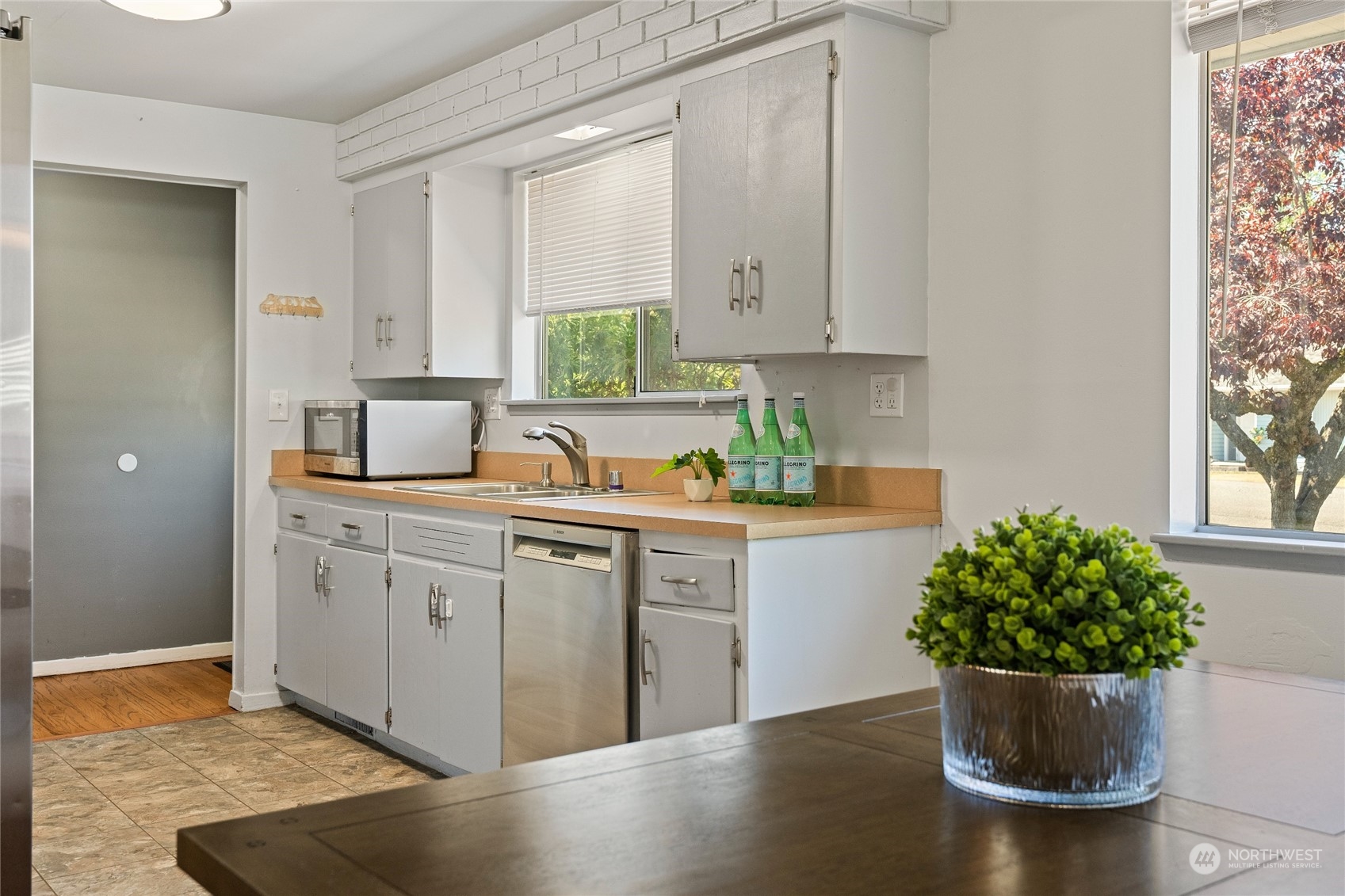 7623 Tyee Road Everett, WA 98203 - Photo 15 of 37 a kitchen with a window and flowers