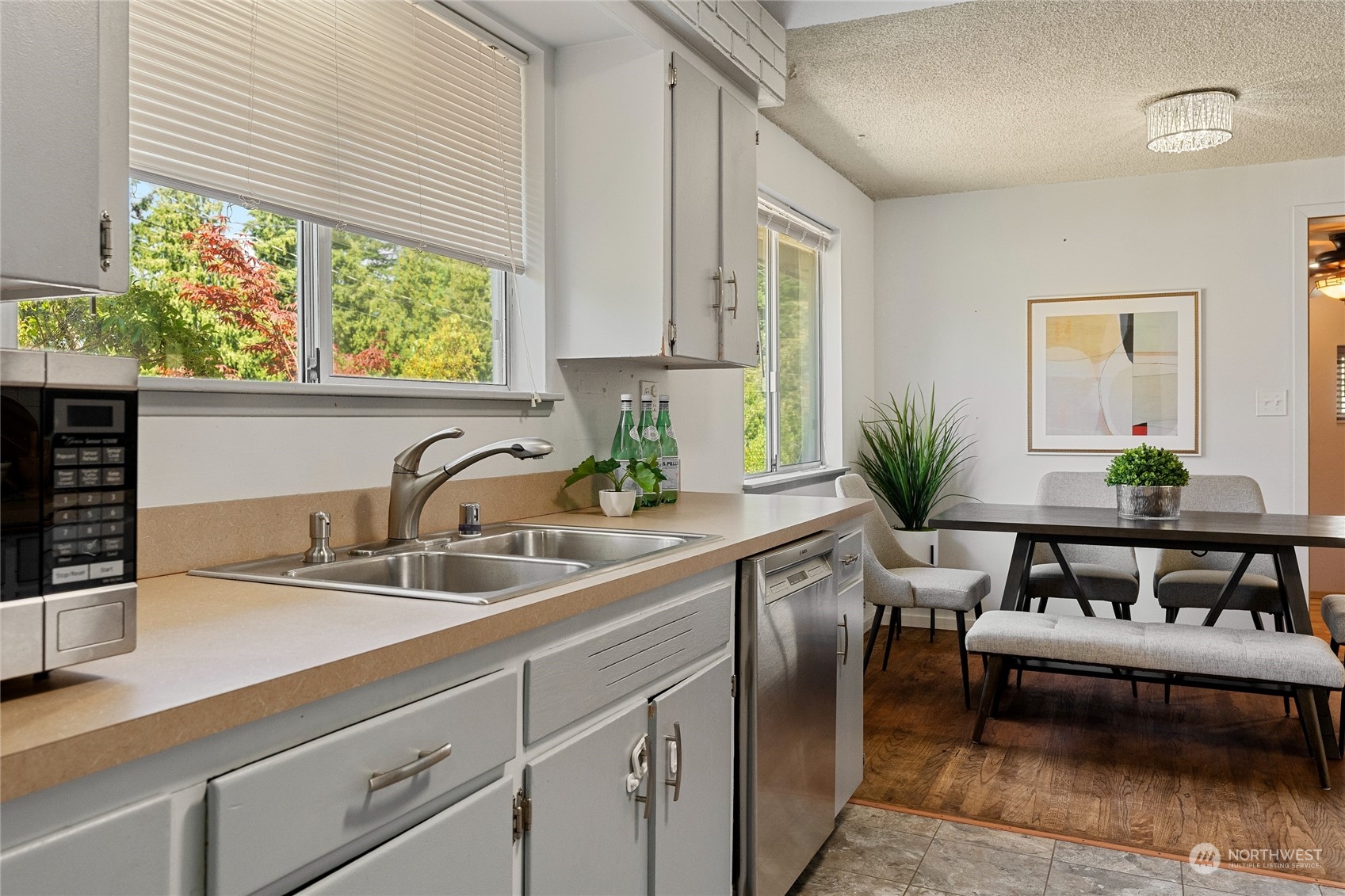 7623 Tyee Road Everett, WA 98203 - Photo 17 of 37 a kitchen with a potted plant on the counter and a sink