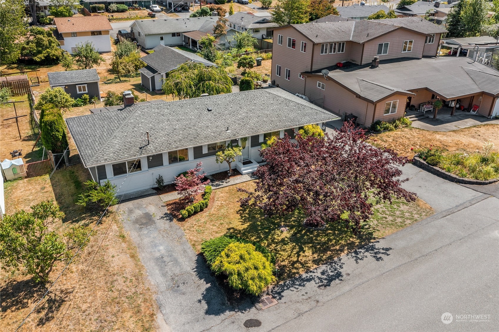 7623 Tyee Road Everett, WA 98203 - Photo 2 of 37 an aerial view of a house with a yard and garden