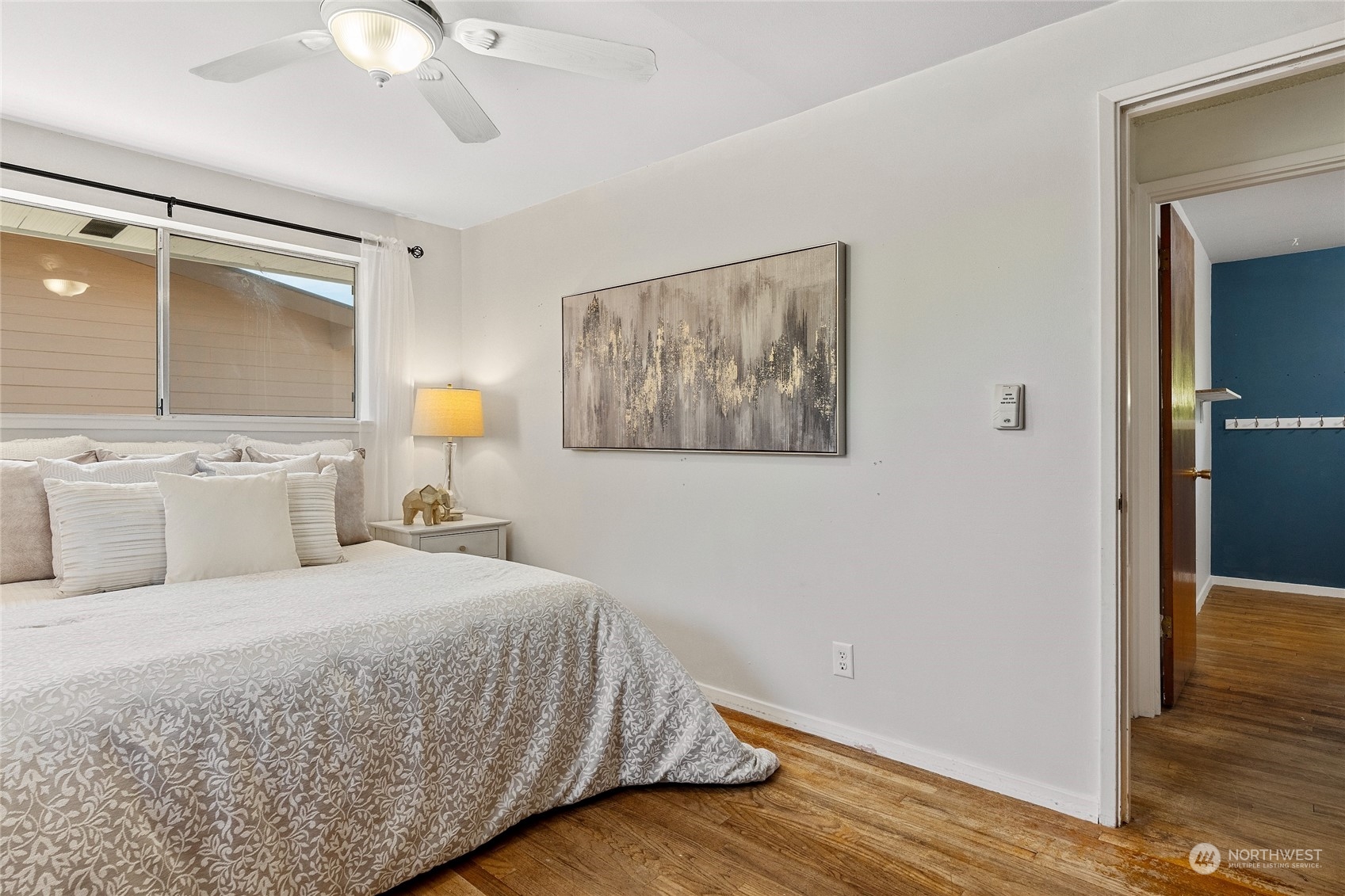 7623 Tyee Road Everett, WA 98203 - Photo 24 of 37 a bedroom with a large bed and a window