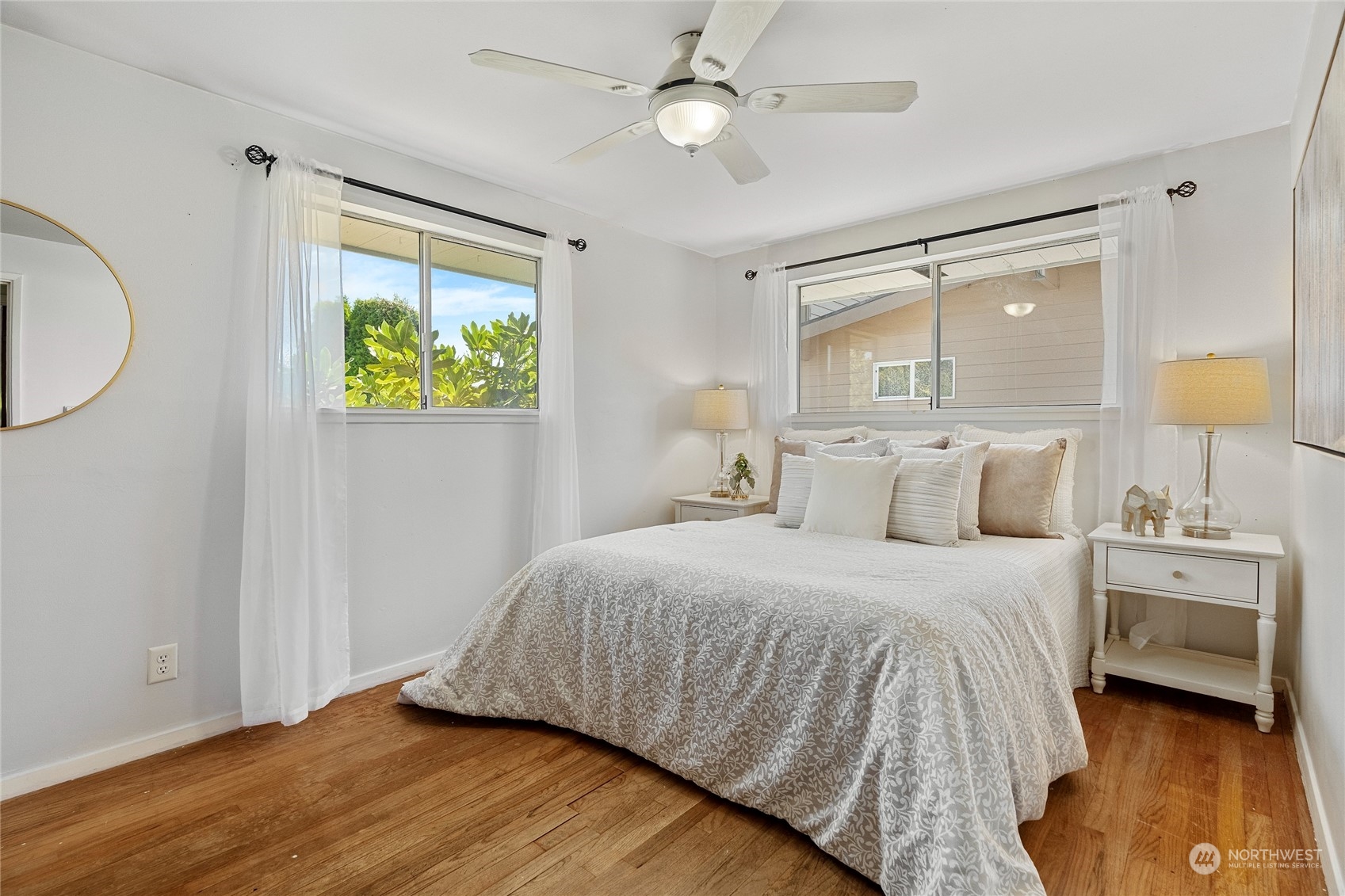 7623 Tyee Road Everett, WA 98203 - Photo 25 of 37 a bedroom with a bed and a chandelier