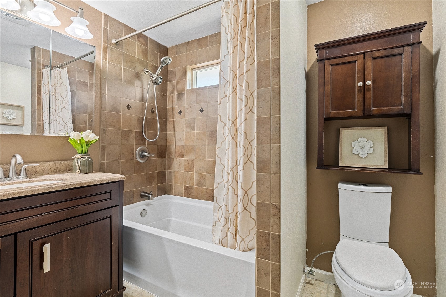 7623 Tyee Road Everett, WA 98203 - Photo 26 of 37 a bathroom with a sink a toilet and shower