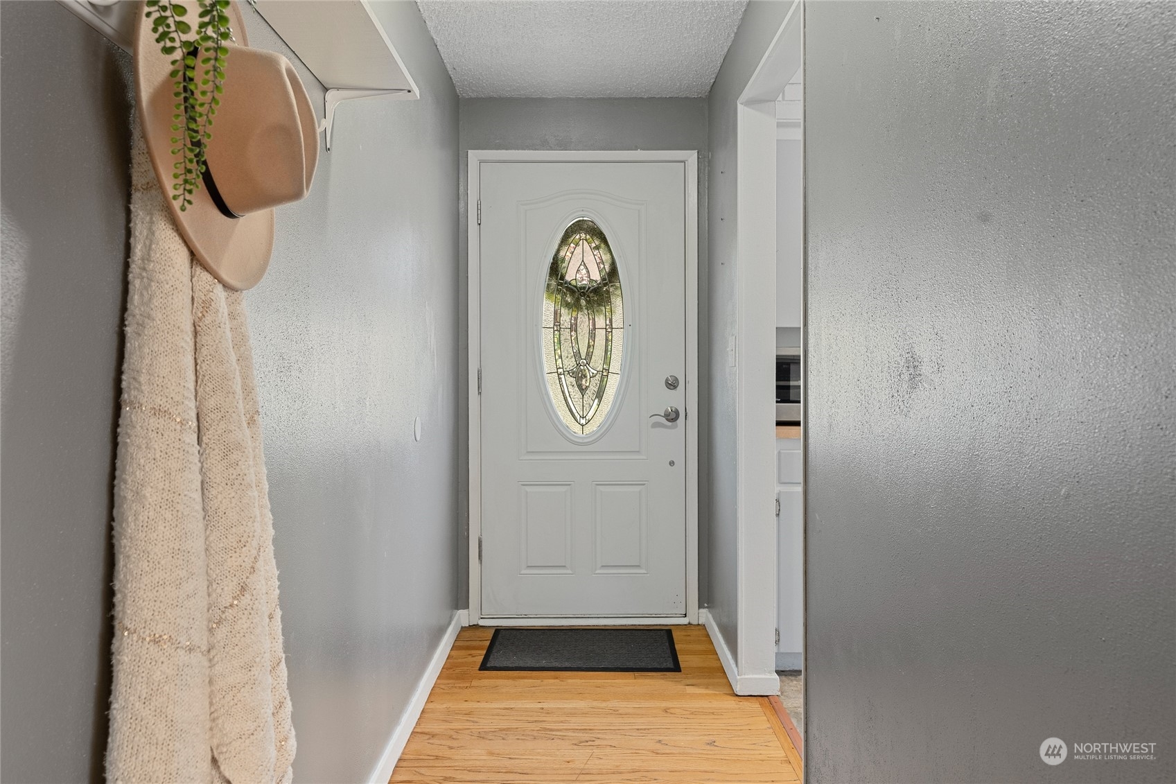 7623 Tyee Road Everett, WA 98203 - Photo 4 of 37 a view of a entryway door with wooden floor