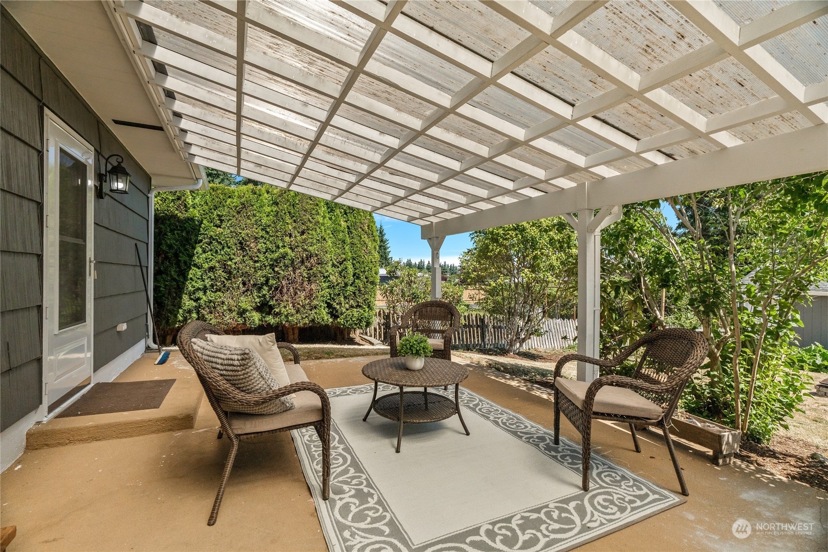 7623 Tyee Road Everett, WA 98203 - Photo 9 of 37 a outdoor living space with furniture and garden view