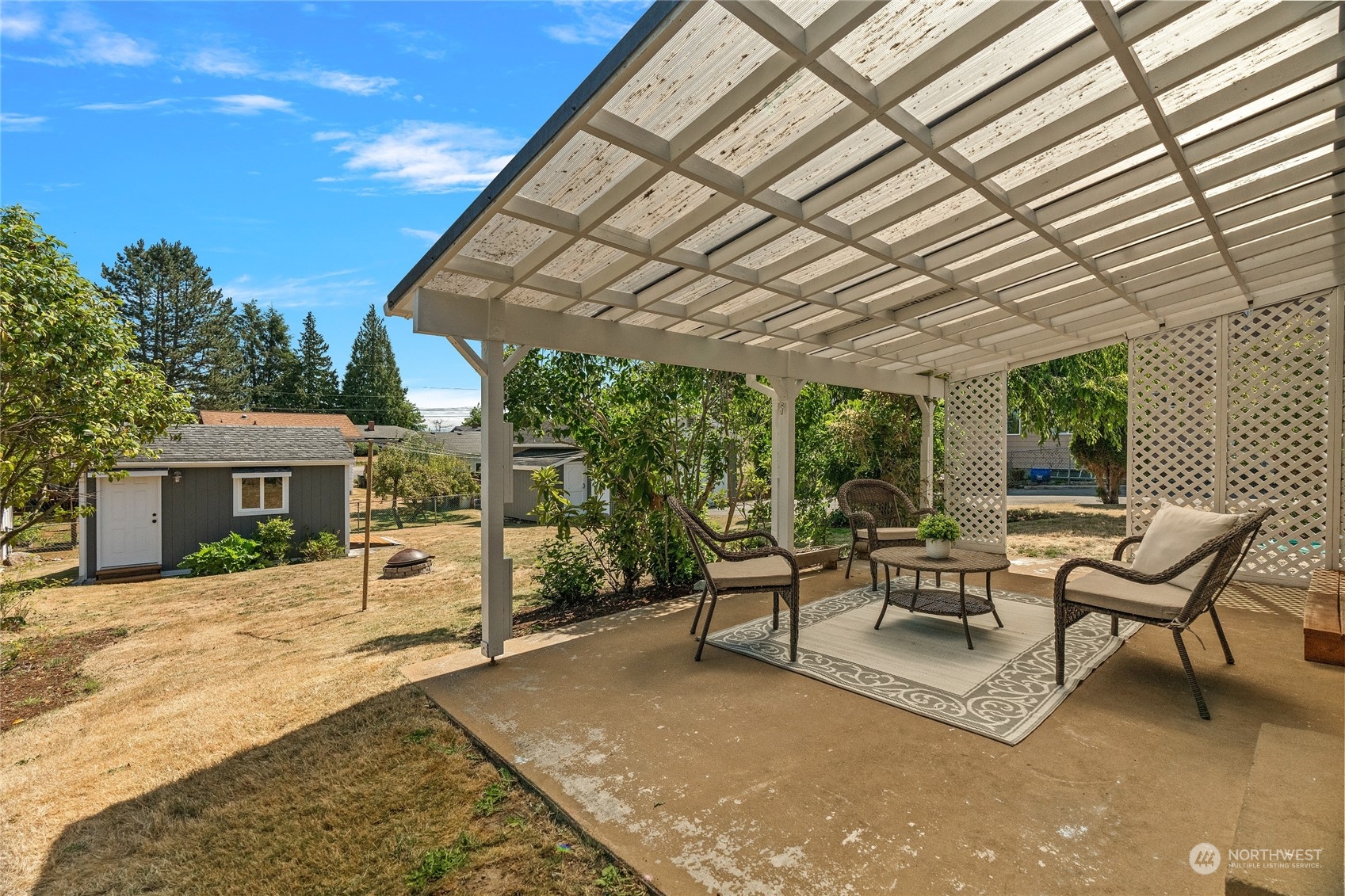7623 Tyee Road Everett, WA 98203 - Photo 10 of 37 a building outdoor space with patio furniture and potted plants