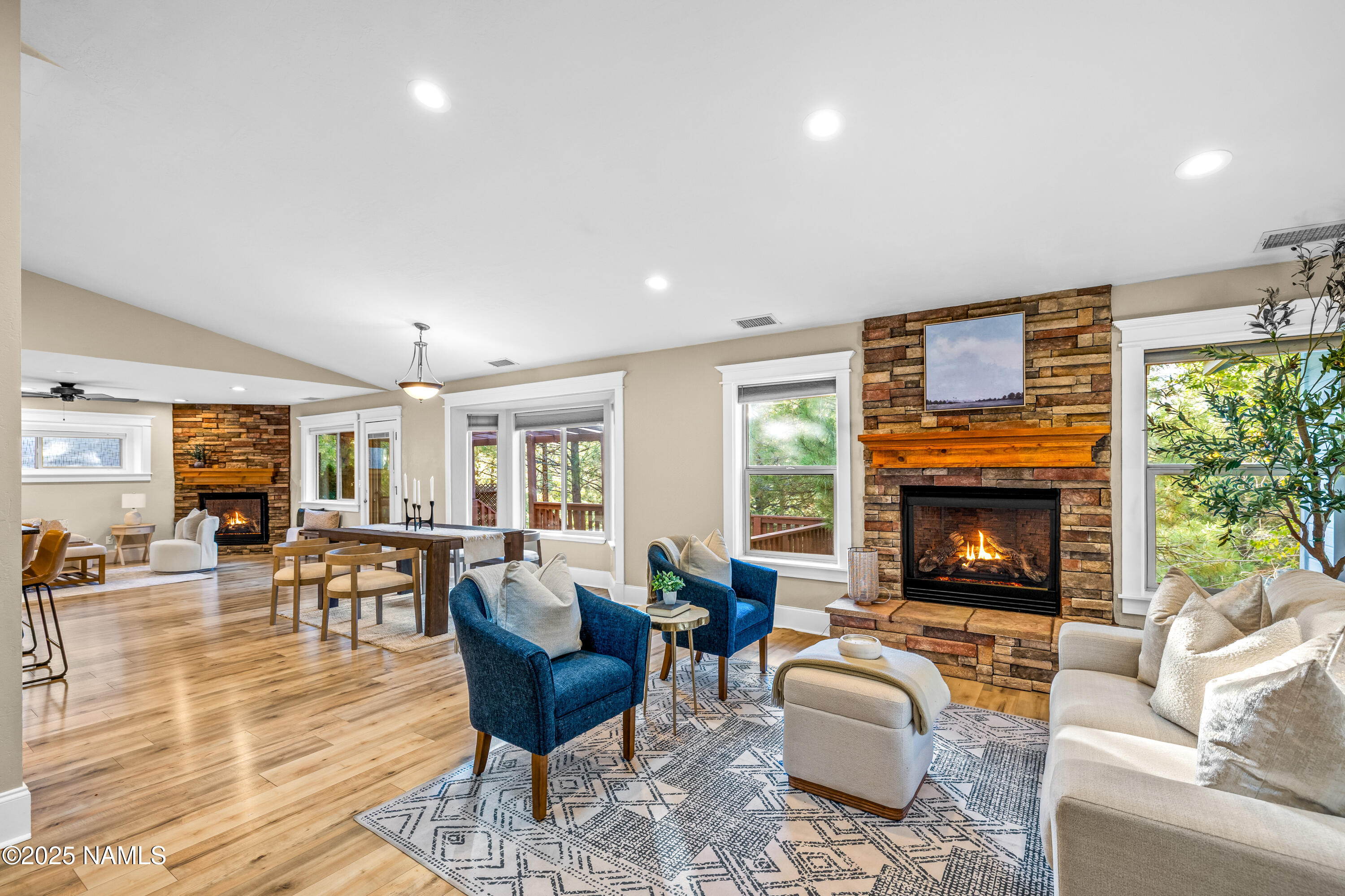 a living room with fireplace furniture and a fireplace