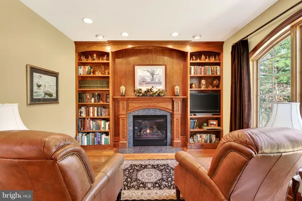 a kitchen with stainless steel appliances granite countertop a sink a stove and a wooden floors