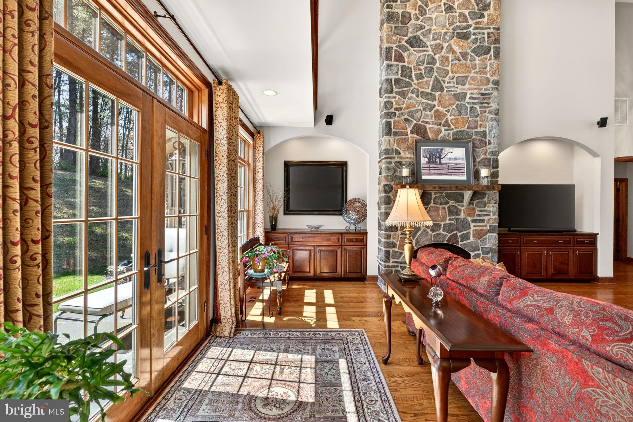 3814 Rocks Station Road Street, MD 21154 - Photo 22 of 70 a living room with furniture a flat screen tv and a fireplace