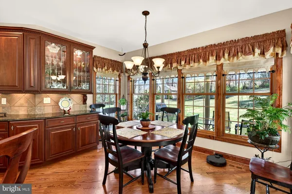 a view of entryway with wooden floor and windows