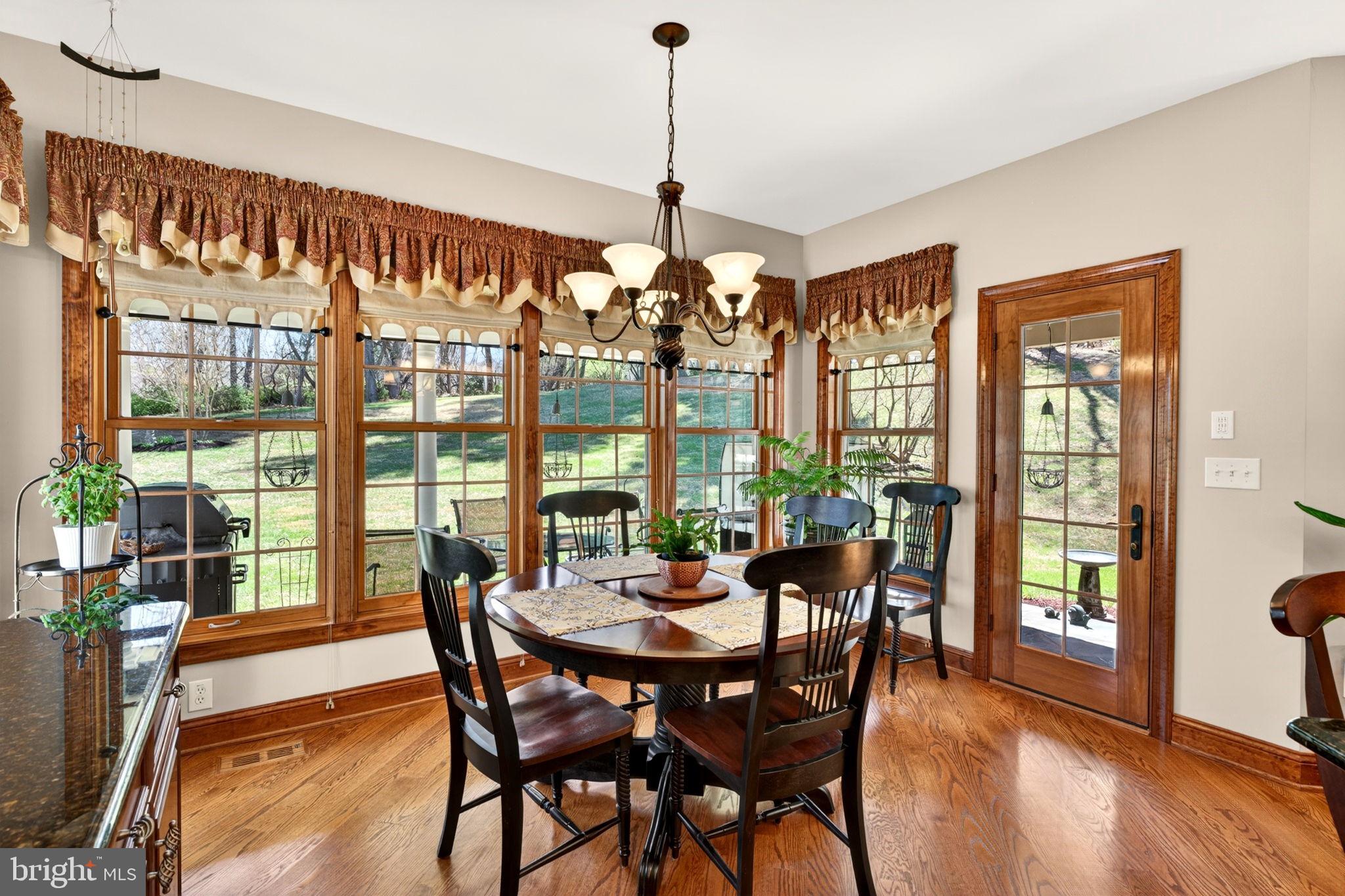 3814 Rocks Station Road Street, MD 21154 - Photo 32 of 70 a view of a dining room with furniture window and wooden floor
