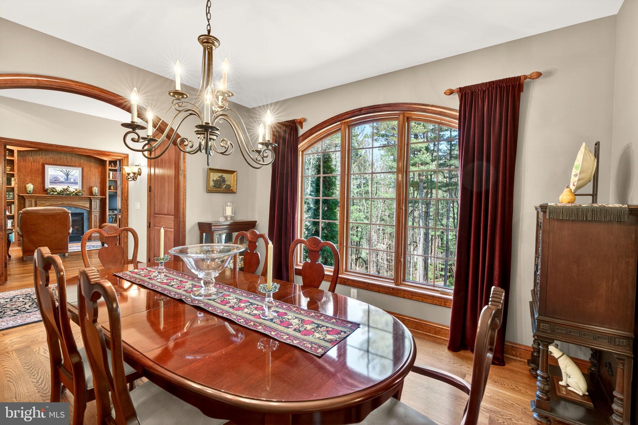3814 Rocks Station Road Street, MD 21154 - Photo 35 of 70 a dining room with furniture a chandelier and wooden floor